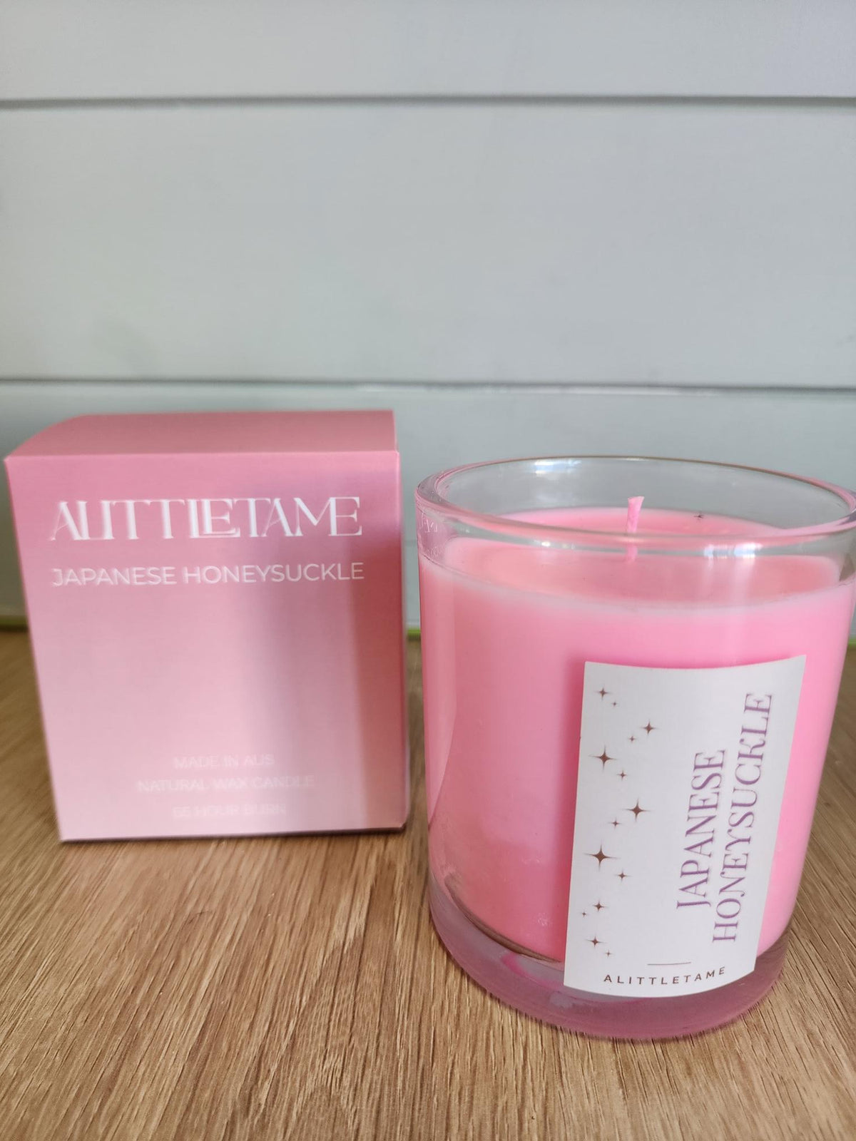 A LITTLE TAME SCENTED CANDLE