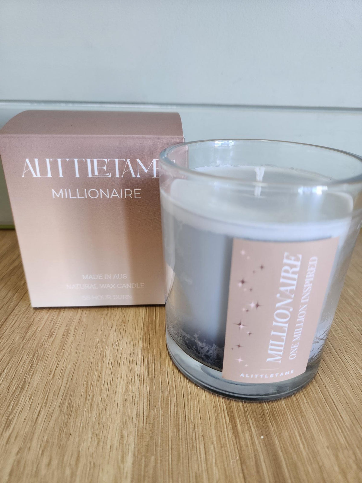A LITTLE TAME SCENTED CANDLE