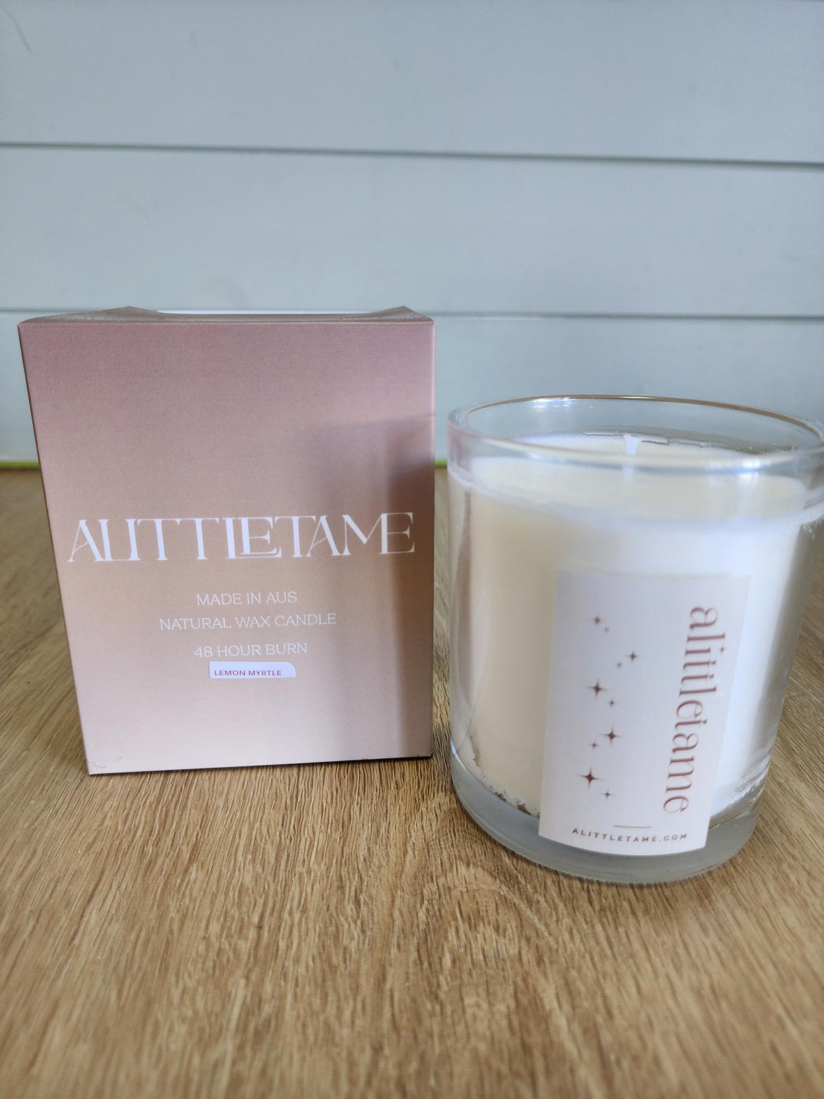 A LITTLE TAME SCENTED CANDLE