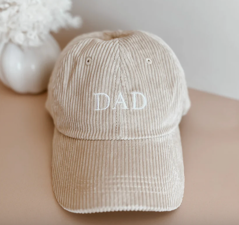 Close up of corduroy cap with "Dad' on the front