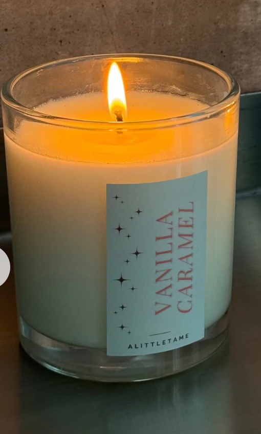 A LITTLE TAME SCENTED CANDLE